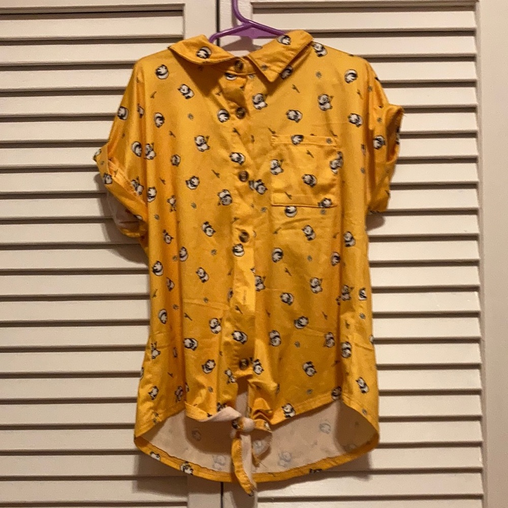 A yellow/panda t-shirt